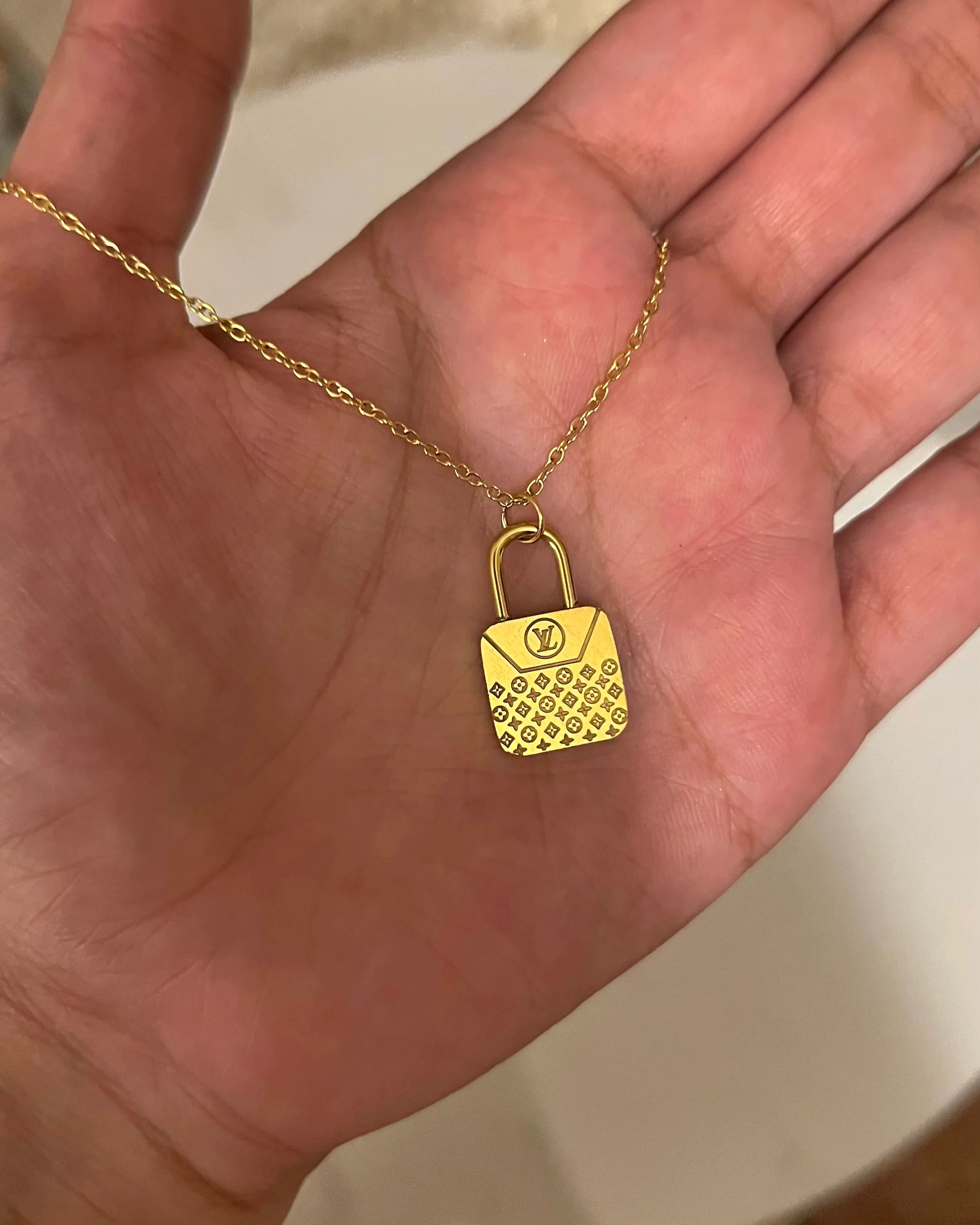 LV Lock Shape Golden Necklace - T Store.pk